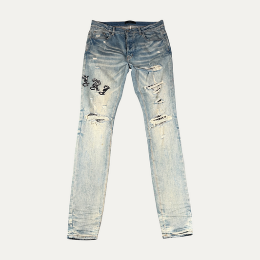 Amiri Light Washed Spellout Jeans