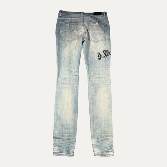 Amiri Light Washed Spellout Jeans